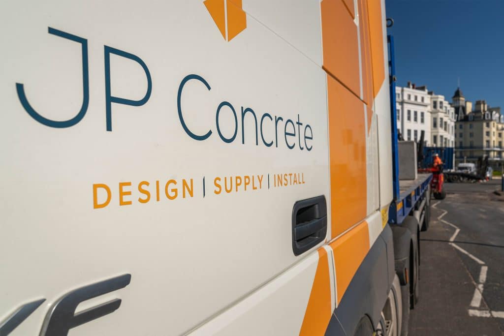 Transporting precast concrete products using an articulated vehicle.
